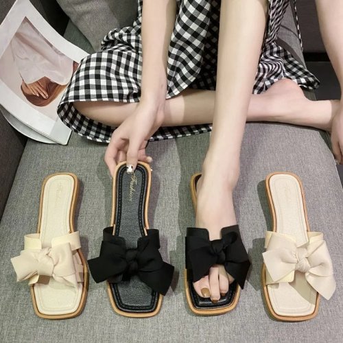 Claquettes femme à nœud papillon — Sandales 'slide' de créateur, élégantes pour la plage