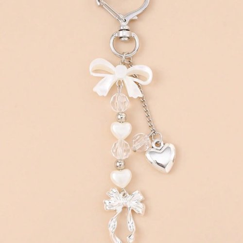 Llavero unisex con moño y perla falsa — estilo playa, accesorio para bolso o coche, regalo para mujer y amigas (1 pza)