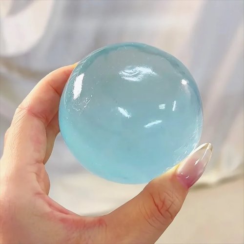 Squishy mochi bleu — Boule anti-stress transparente et souple, rebond rapide