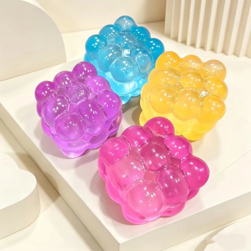 Juguete antiestrés 'pop' 9 casillas — burbujas transparentes de colores, formato bolsillo