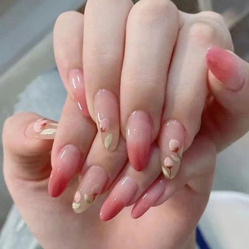 Uñas postizas press-on nude transparentes, degradado rosa blush con tulipán pintado a mano, forma almendra medio-larga, listas para usar