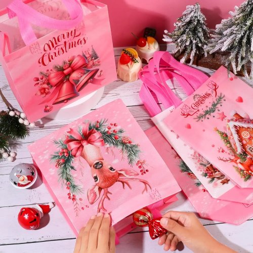 Saco de presente de Natal rosa em não tecido, reutilizável, com pega — padrão Pai Natal e rena para crianças