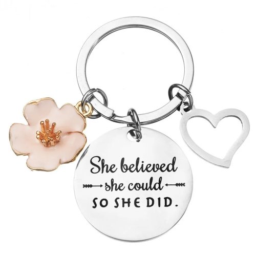 Porta‑chaves em aço inoxidável com motivo de pétalas de girassol e pendente em forma de coração cor pêssego — pequena lembrança inspiradora