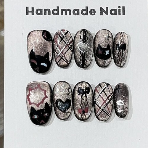 Lot de 10 ongles press-on 'cat eye' noirs, ovales courts, faits main, motif lignes 'chat'