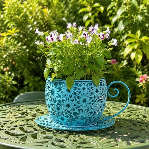 Rustic iron teacup planter with floral cutouts — large decorative flower pot for living room & terrace