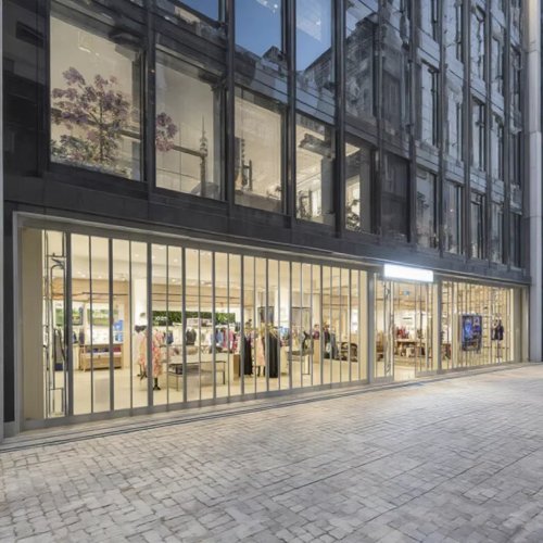 Porte enroulable moderne en polycarbonate cristal personnalisée pour centres commerciaux et magasins