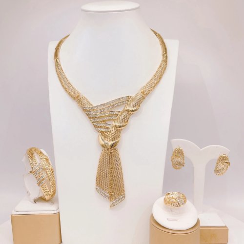 Elegante gouden strik sieraden set – ketting, ring, oorbellen en armband
