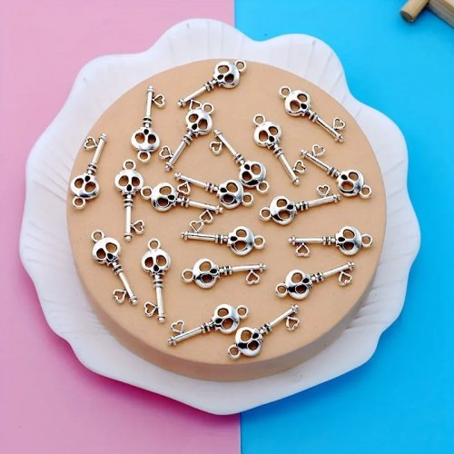30 pcs breloques porte-clés tête de mort vintage en alliage de zinc – Parfaites pour bijoux Halloween, colliers, boucles d'oreilles