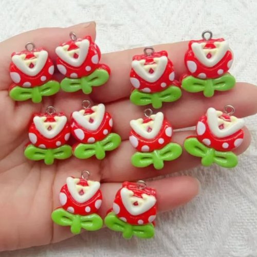 10 uds. Colgantes de resina de hombre de dibujos animados comiendo una flor, accesorios DIY para pulsera, collar y llavero